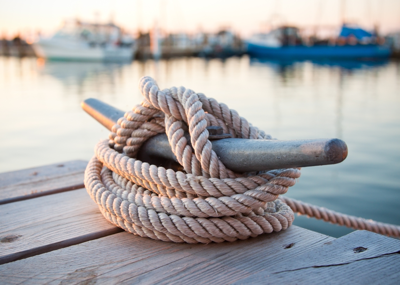 Dock cleat with boats at marina